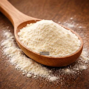 Full Cream Milk powder on wooden spoon