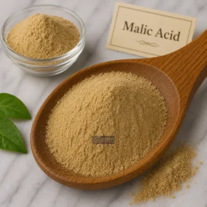 Malic Acid powder in a wooden spoon