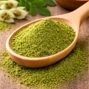 Moringa powder on rustic wood