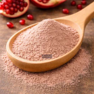 Pomegranate extract powder on wooden spoon