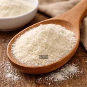 Sodium erythorbate on wooden spoon