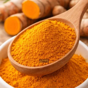 Vibrant turmeric in wooden spoon